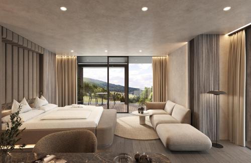 a bedroom with a large bed and a living room at Viktoria Alpine Hideaway in Avelengo