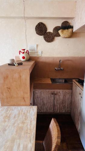 a kitchen with a sink and a counter top at Edificio RexII in Es Pujols