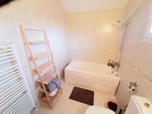 a bathroom with a white toilet and a sink at Golden Sunset Villa in Tatlisu