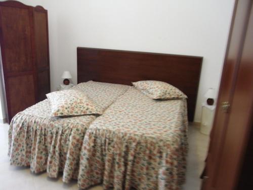 سرير أو أسرّة في غرفة في Apartment Sorrento 3