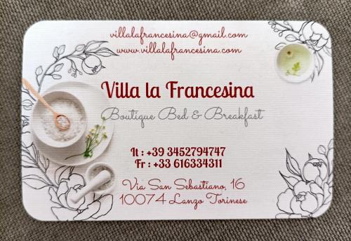 a invitation to a wedding on a white card with flowers at B&B La Francesina in Lanzo Torinese