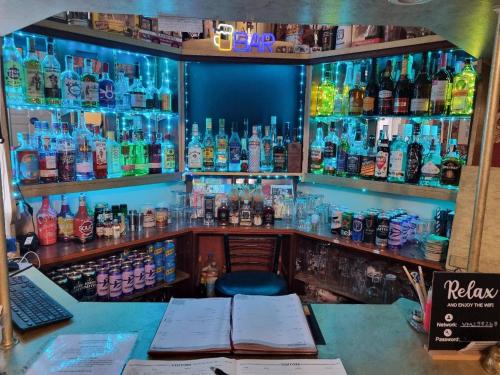 a bar with a lot of bottles of alcohol at Spalite Hotel in Gloucester