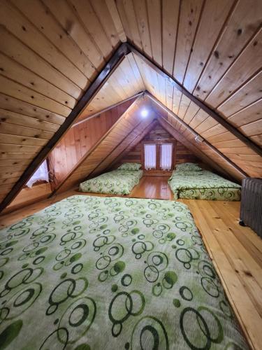 a bedroom with a bed in a attic at Kraljeva breza in Divčibare