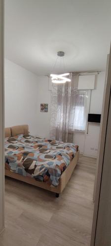 a bedroom with a bed in a room at Casa Martina in Cogoleto