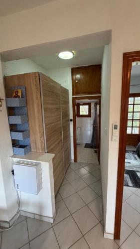 a room with a staircase and a hallway with a house at Halkidiki in Skala Fourkas