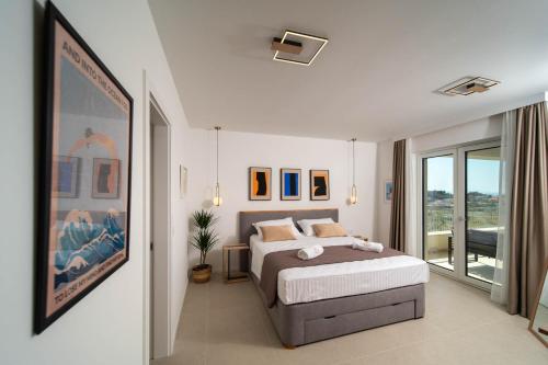 a bedroom with a bed and a large window at NEW! Villa Rabella - Luxury Oasis, Island Rab in Rab