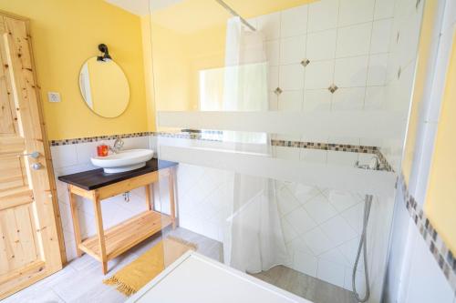 a bathroom with a sink and a shower at Gorski biser in Mojstrana