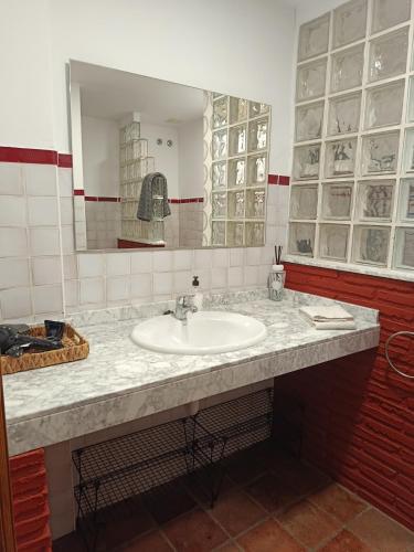 a bathroom with a sink and a mirror at HARO EXPERIENCE Baco in Haro