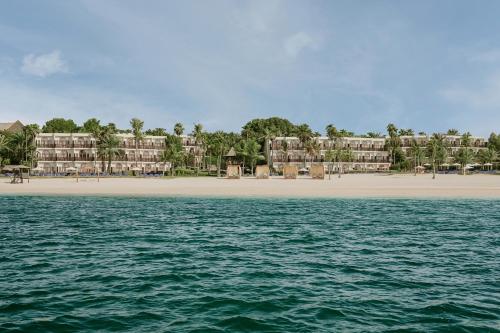 a view of the beach from the water at JA Palm Tree Court, Dubai in Dubai