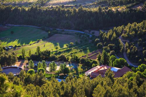an aerial view of a village in the hills at Hospedium Hotel Val de Pinares in Bogarra