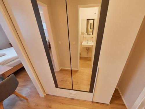 a mirror in a room with a bathroom at Appartement Serges mit Pool und Sauna in Freyung in Freyung
