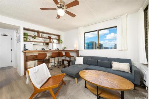a living room with a couch and a table at Island Vacations in Honolulu