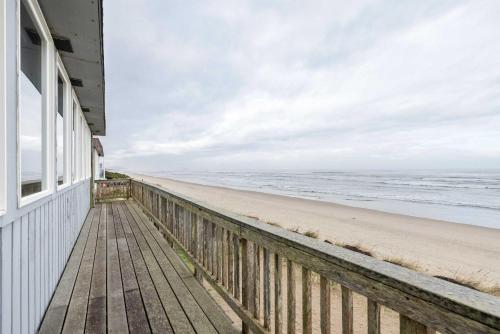 a house on the beach with a view of the ocean at Friend-Ship in Rockaway Beach