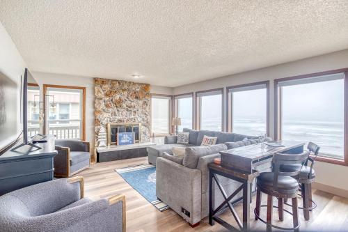 a living room with a couch and a table at Friend-Ship in Rockaway Beach
