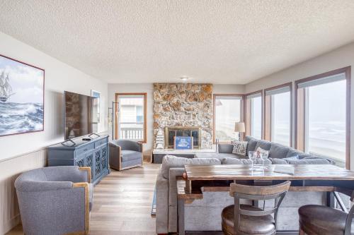 a living room with a couch and a table at Friend-Ship in Rockaway Beach
