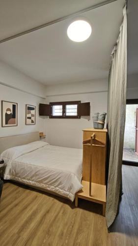 a bedroom with a large bed and a window at RC vacanze interno 57 in Rocca di Mezzo