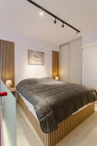 a bedroom with a large bed in a room at EVE's house 6 - Corinth center loft in Korinthos