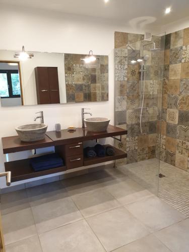 a bathroom with two sinks and a shower at Ajaccio Sanguinaires in Ajaccio