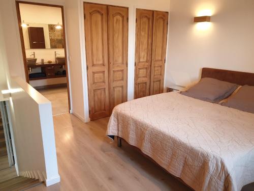 a small bedroom with a bed and a bathroom at Ajaccio Sanguinaires in Ajaccio