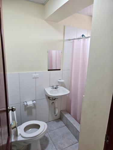 a bathroom with a toilet and a sink at Hostal Haziel in Salinas