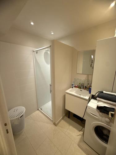 a bathroom with a shower and a toilet and a sink at French Riviera Golf in Mandelieu-La Napoule