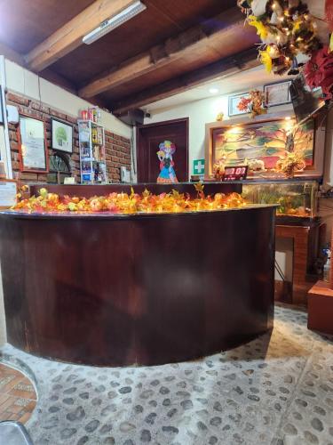 a counter in a restaurant with a pile of food at Posada Arny in Tepotzotlán