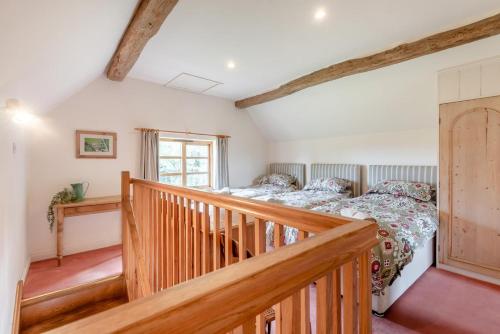 a bedroom with a bed and a staircase at 4 Bed in Shrawley oc-s34861 in Shrawley