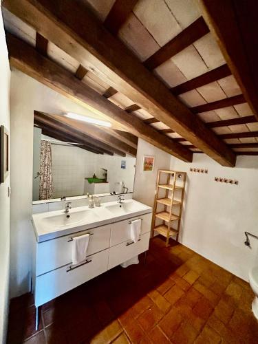 a bathroom with a sink and a mirror at Can Petitu in Amer