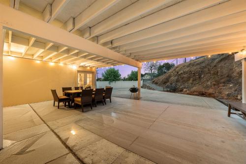 an outdoor patio with a table and chairs at Entire Private Home with 4 Bedrooms 2 Bathrooms, 6 Beds, King Bed, 6 Parking, Big Yard, Available Now in Spring Valley