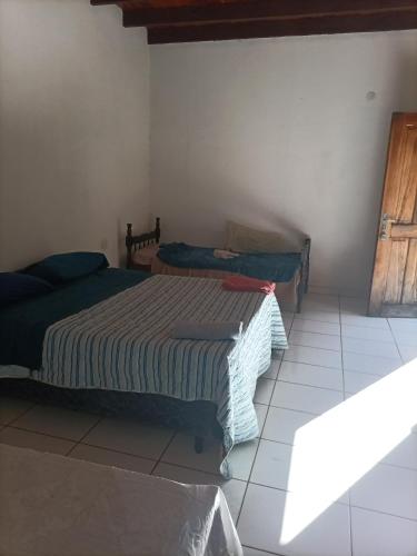 a bedroom with two beds in a room at Bodegon in Encarnación