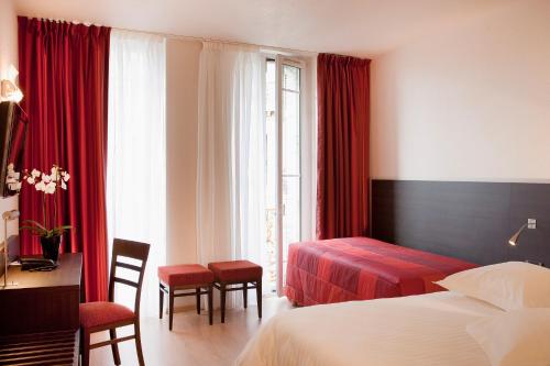 Postel nebo postele na pokoji v ubytování Escale Oceania Marseille Vieux Port