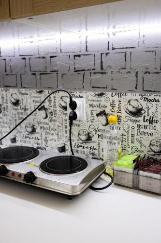 a toaster is plugged into a box on a counter at FiveHostel in Krakow