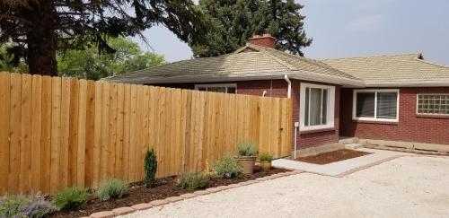 a wooden fence in front of a house at The Lindon House in Lindon