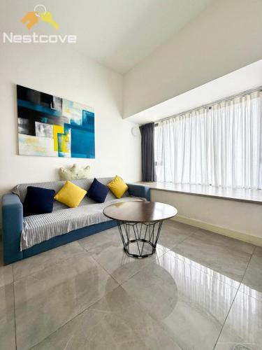 a living room with a couch and a table at Imperio Residences Private Bathtub or Jacuzzi by Nestcove in Malacca