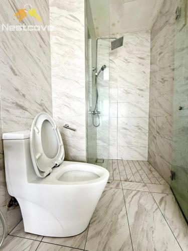 a bathroom with a toilet with the seat up at Imperio Residences Private Bathtub or Jacuzzi by Nestcove in Malacca