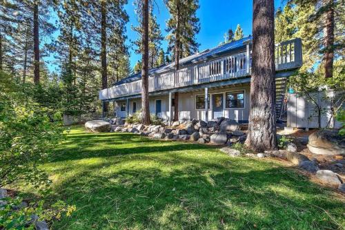 an exterior view of a house with trees at Minnow's Run in Kings Beach