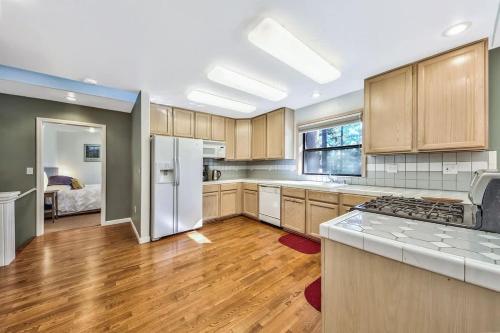a kitchen with wooden cabinets and a white refrigerator at Minnow's Run in Kings Beach