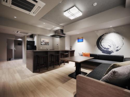 a living room with a couch and a table at GRAND MONday ASAKUSA in Tokyo