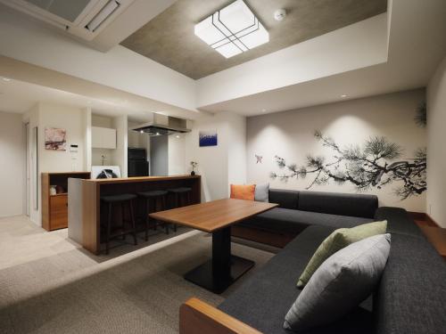a living room with a couch and a table at GRAND MONday ASAKUSA in Tokyo
