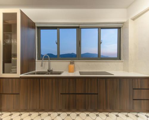 a kitchen with a sink and a window at Coral Boutique 2 in Nha Trang