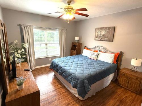 a bedroom with a bed and a ceiling fan at Lakefront and Lake View Condo on Indian Point in Branson