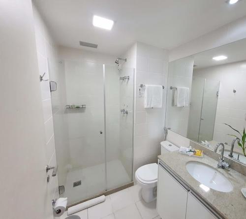 a bathroom with a shower and a toilet and a sink at Vision Hotel em Brasília 60300 in Brasília