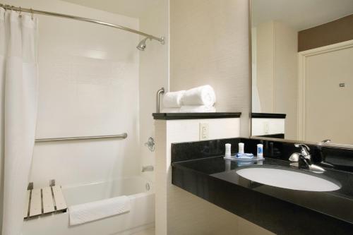 a bathroom with a sink and a shower at Fairfield Inn & Suites by Marriott Quincy in Quincy