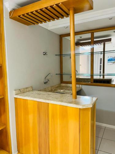 a kitchen with a sink and a counter top at Londrina Hostel Il in Londrina