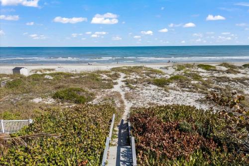 an aerial view of the beach and the ocean at 111 S Atlantic Ave in Cocoa Beach