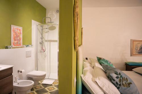 a bathroom with a shower and a toilet and a sink at Verde romantico in Città della Pieve