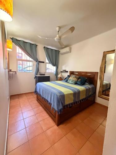 a bedroom with a bed in a room at Luxury Casa Cindy in Puerto Escondido