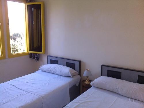 Ένα ή περισσότερα κρεβάτια σε δωμάτιο στο Pharaohs Hotel