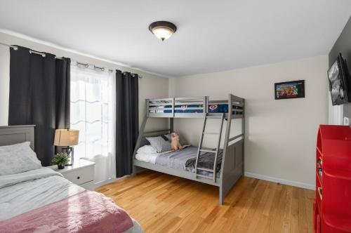 a bedroom with a bunk bed with a dog on it at Summit Chalet at Stillwater in Pocono Summit