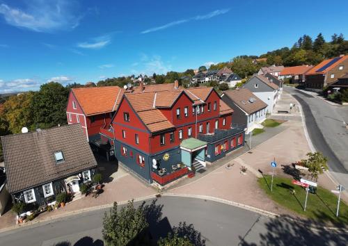 an overhead view of a town with houses and a street at Hotel Schneiderhof in Braunlage